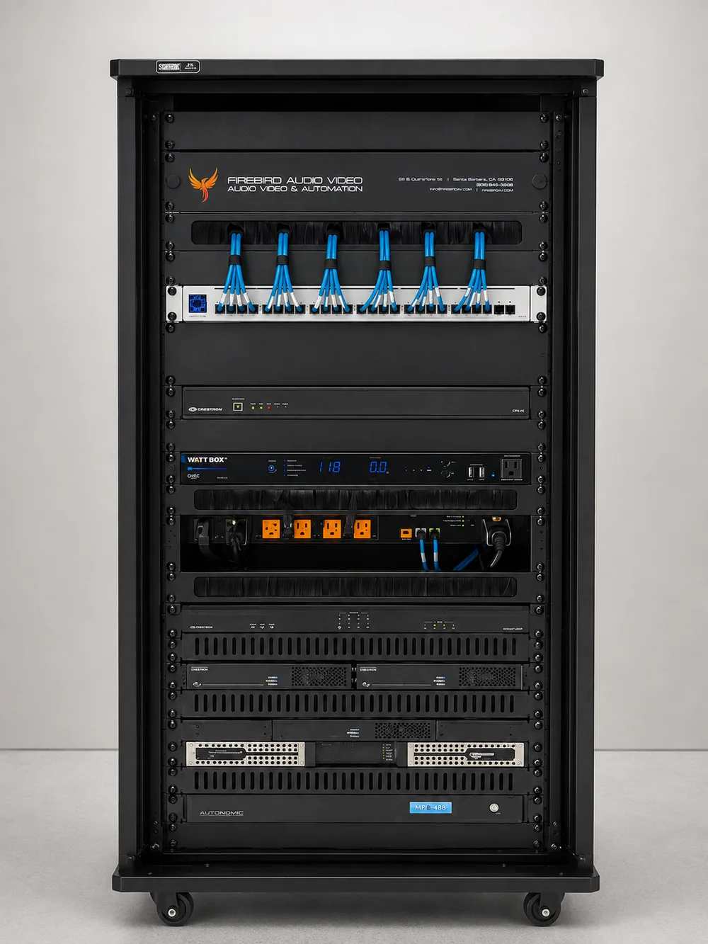 Firebird AV equipment rack — branded, labeled, and dressed structured cabling with Crestron control