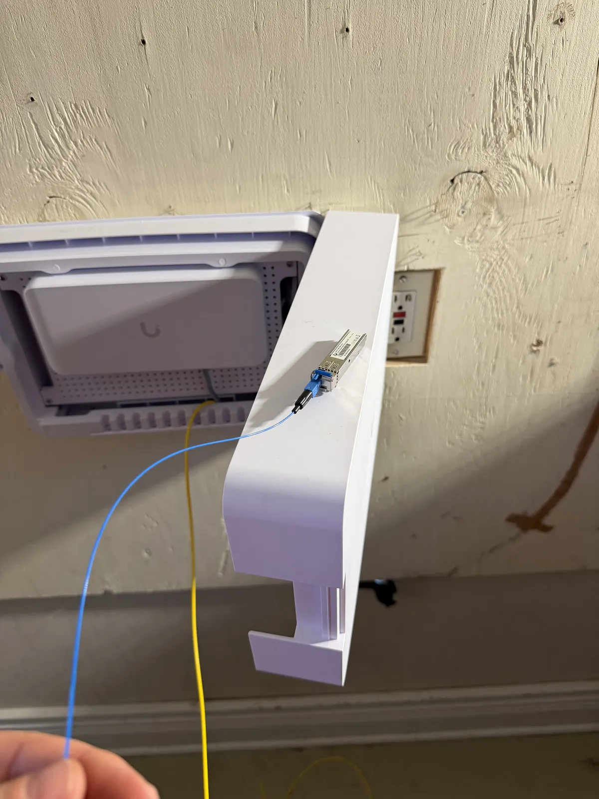 Installing one of 22 WiFi 7 access points during the estate network upgrade