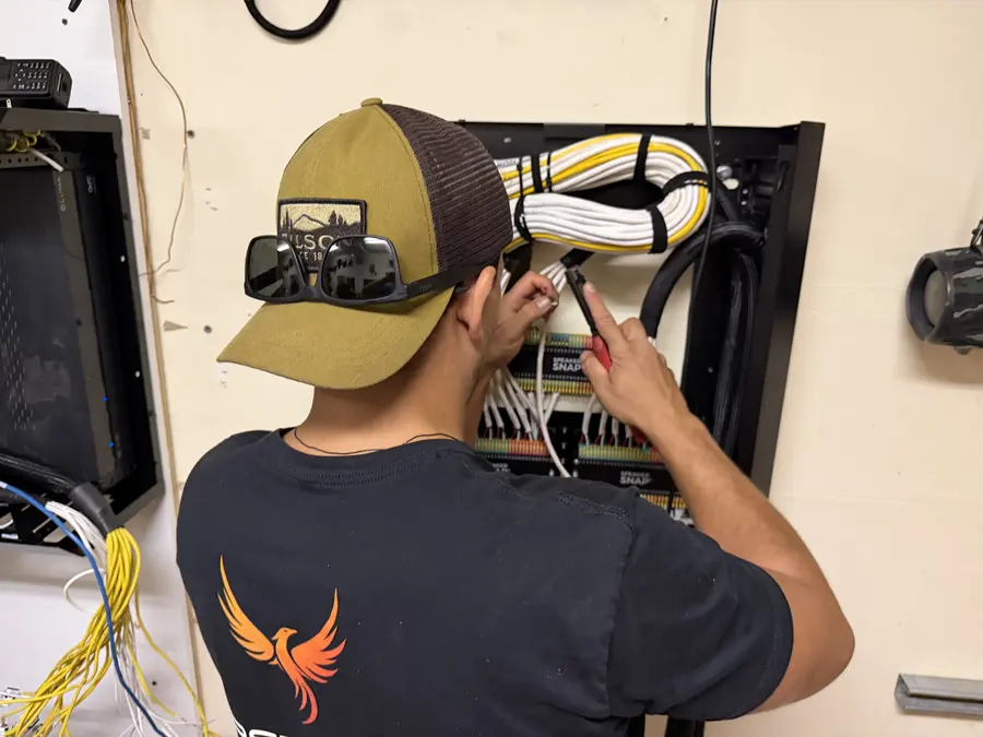 Termination work: one conductor at a time, each one labeled.