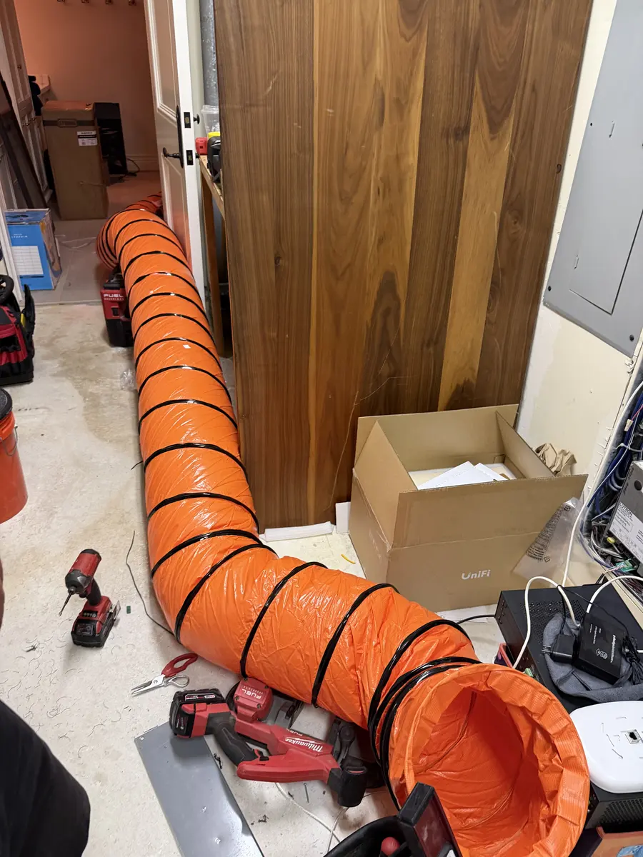 Floor and duct protection down before demo starts — it's an occupied home, not a job site.