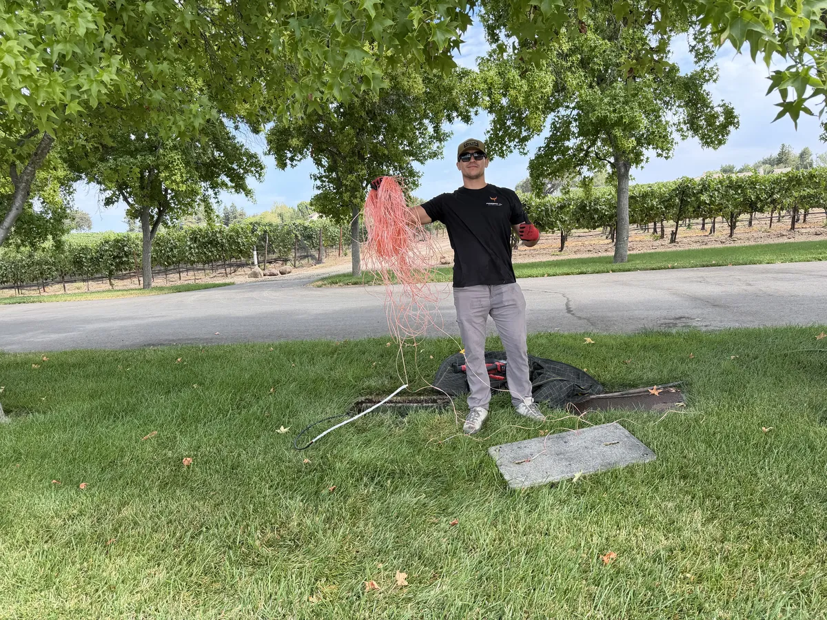 Firebird crew pulling direct-burial fiber and Cat 6 across the Santa Ynez estate grounds